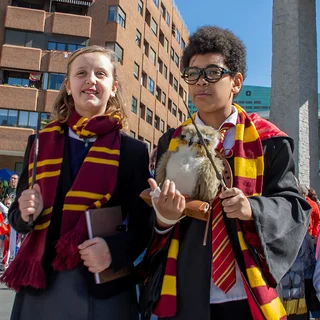 Children are seen dressed as Harry Potter characters at a carnival in Spain.